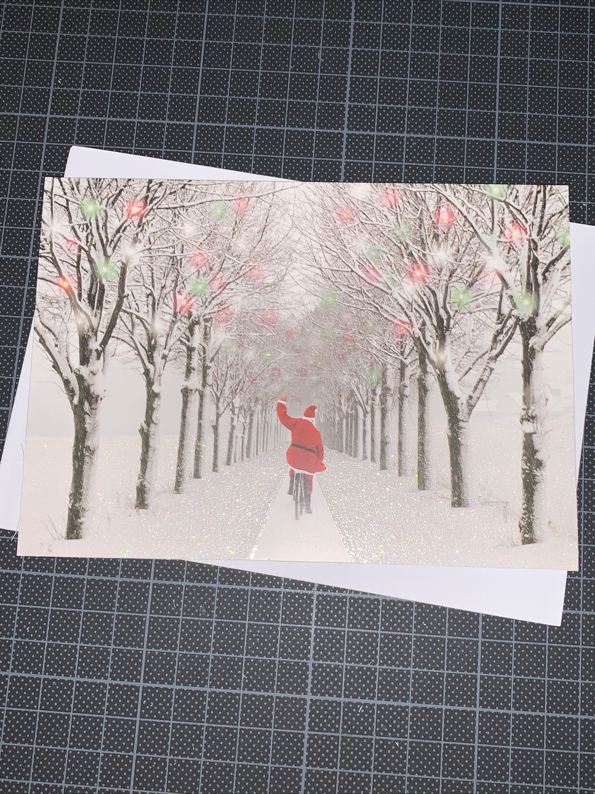Graphique Christmas Card: Waving Santa Bicycle Down The Snow Merry & Bright