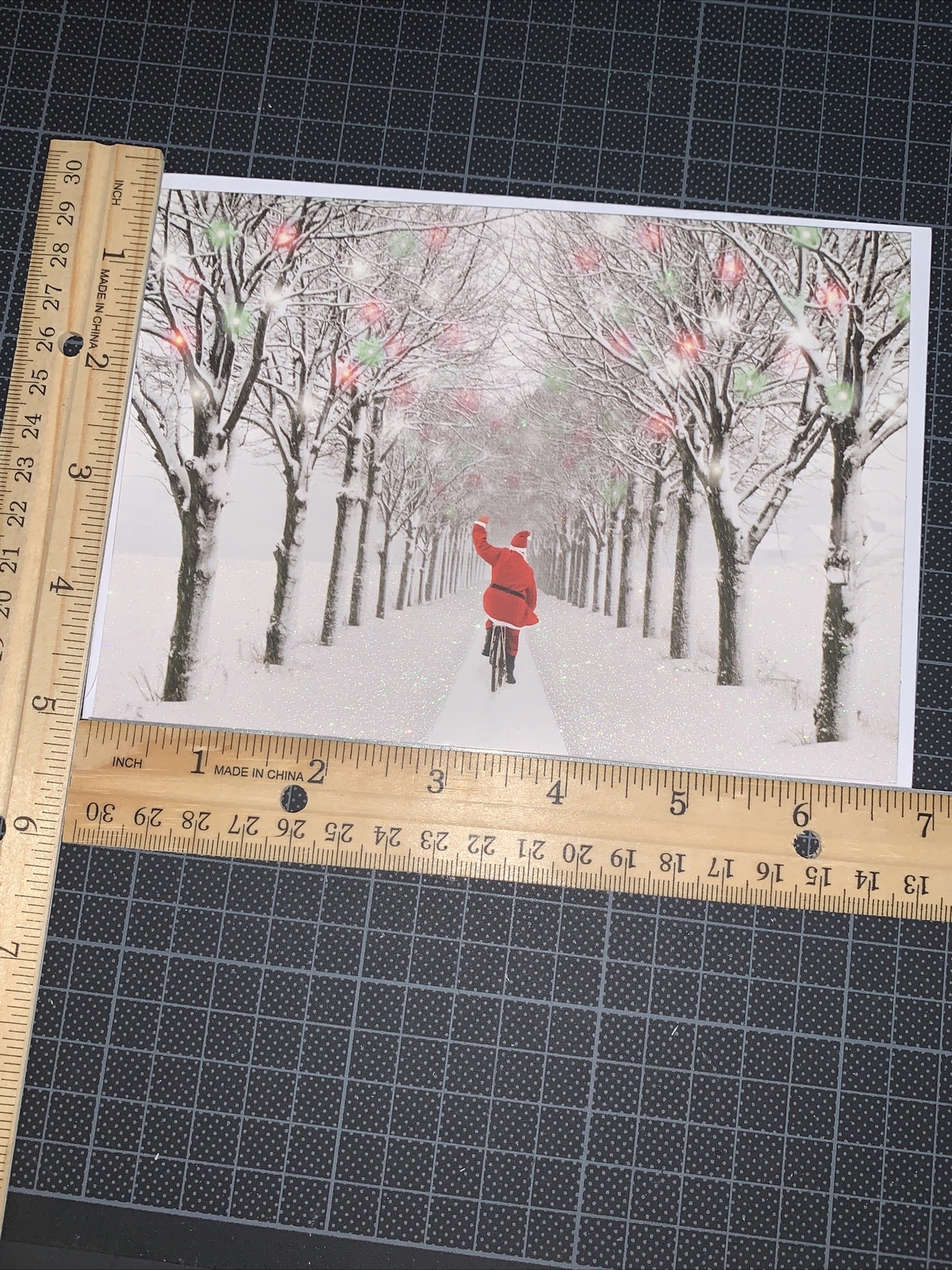 Graphique Christmas Card: Waving Santa Bicycle Down The Snow Merry & Bright