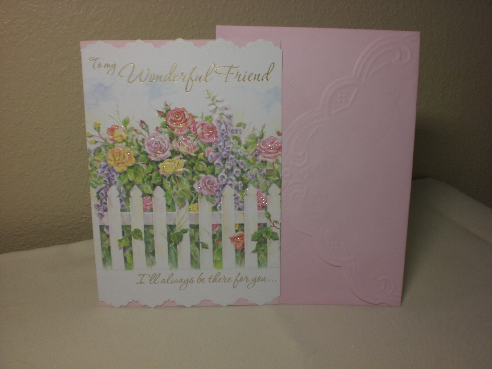 Carol’s Rose Garden – Friendship – Roses by a white picket fence is on front